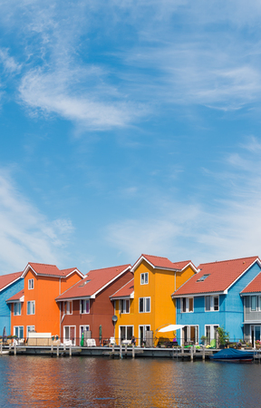 colorful wooden houses in the Groningen Reitdiep harbor in the netherlandsの写真素材
