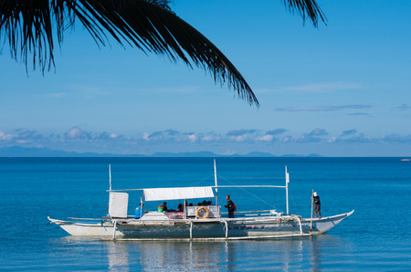 DONSOL, PHILIPPINES - JUNE 2, 2015: Traditional philippine bangkas with tourists on their way to see the whale sharks in the surrounding watersのeditorial素材