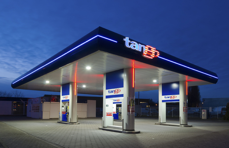 ENSCHEDE, NETHERLANDS - FEBRUARY 28, 2015: Tango gas station at night. Tango CV, a dutch company, introduced and operates unmanned gasoline stations. In 2013 they owned 150 stations.のeditorial素材