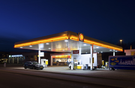 ENSCHEDE, NETHERLANDS - FEBRUARY 28, 2015: Shell gas station at night. Royal Dutch Shell, a dutch-british multinational, is the most profitable company in the netherlandsのeditorial素材