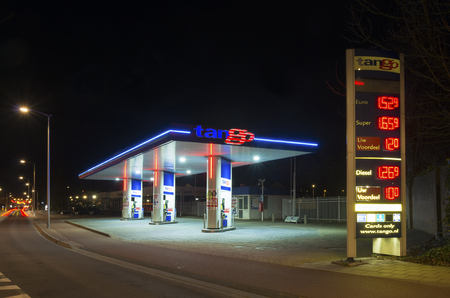 OLDENZAAL, NETHERLANDS - FEBRUARY 28, 2015: Tango gas station at night. Tango CV, a dutch company, introduced and operates unmanned gasoline stations. In 2013 they owned 150 stations.のeditorial素材