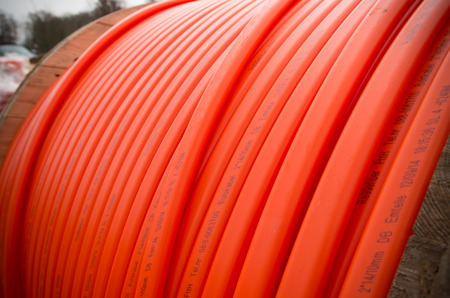 HENGELO, NETHERLANDS - MARCH 28, 2015: Orange fiber cable owned by Reggefiber, a Dutch company that...