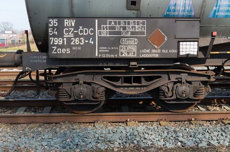 OLDENZAAL, NETHERLANDS - MARCH 23, 2015: Closeup of the wheels of a cargo train waggon waiting on...
