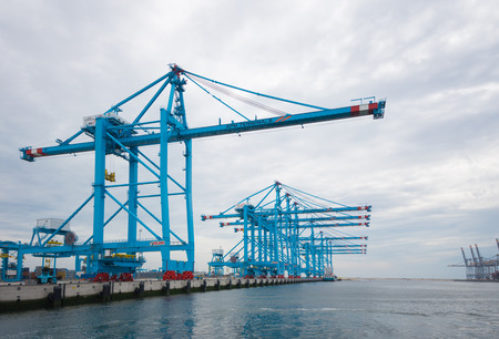 ROTTERDAM, NETHERLANDS - JUNE 28, 2015: Large harbor cranes in the harbor. Rotterdam is the largest harbor in Europe.のeditorial素材
