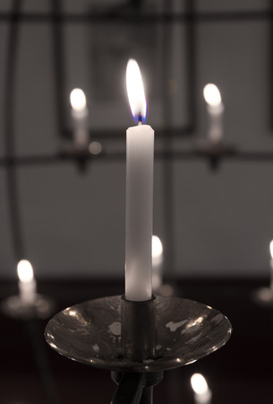 burning candle in a churchの写真素材