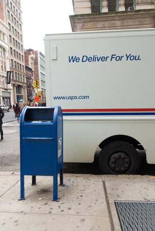 NEW YORK - MAY 2, 2016: White USPS mail delivery truck in the streets of New York. USPS is one of the largest mail delivery companies in the USA.のeditorial素材
