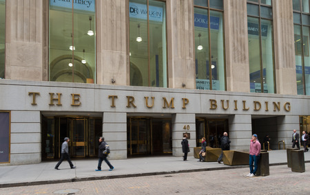 NEW YORK - APRIL 27, 2016:  Entrance of the Trump building with unknown people in front of it