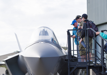 LEEUWARDEN, NETHERLANDS - JUNE 6, 2016: Visitors around a F-35 JSF dummy during the Royal Dutch Air Force Days 2016.のeditorial素材