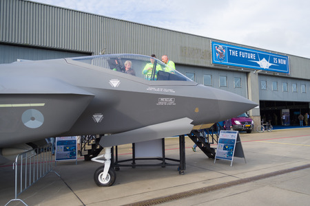 LEEUWARDEN, NETHERLANDS - JUNE 6, 2016: Visitors around a dummy F-35 JSF during the Royal Dutch Air...