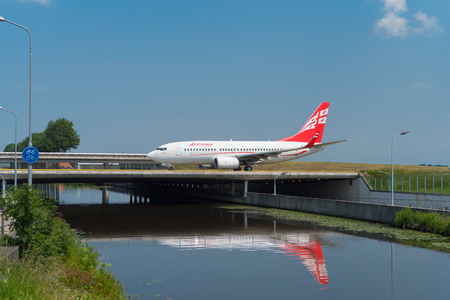 SCHIPHOL, NETHERLANDS - JUNE 4, 2016: Georgian airways Airzena airplane taxiing to the runway on amsterdam schiphol airportのeditorial素材