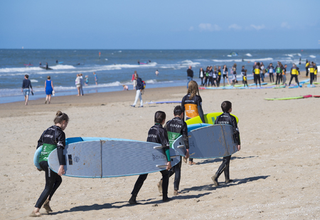 SCHEVENINGEN, NETHERLANDS - JULY 3, 2016: Surf school students in action on the dutch North Sea coastのeditorial素材