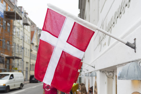 danish flag in the streets of copenhagen, the danish capitalの写真素材
