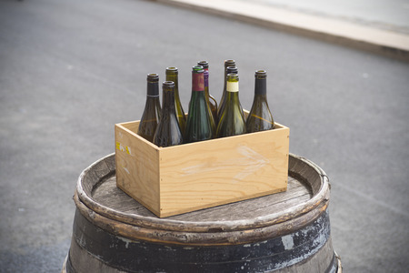 cardboard box with empty wine bottles 