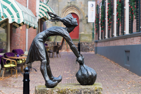 OOTMARSUM, NETHERLANDS - DECEMBER 3, 2016: Bronze statue of sjalotje (little onion girl), created by Berend Seiger. The onion is the local carnival symbolのeditorial素材