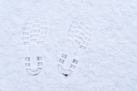 pair of footsteps in the snowの写真素材