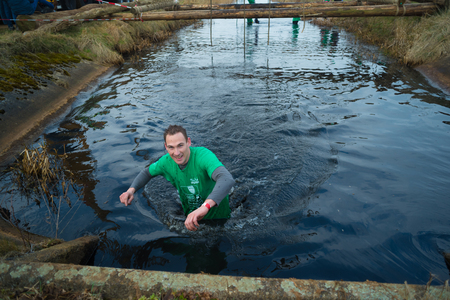 WESEPE, NETHERLANDS - MARCH 25, 2018: Unknown athletes doing the 20th Wesepe survival run, also the final edition.のeditorial素材