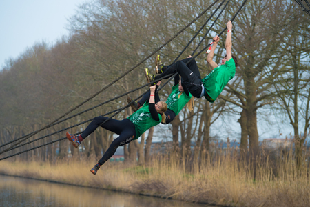 WESEPE, NETHERLANDS - MARCH 25, 2018: Unknown athletes doing the 20th Wesepe survival run, also the...