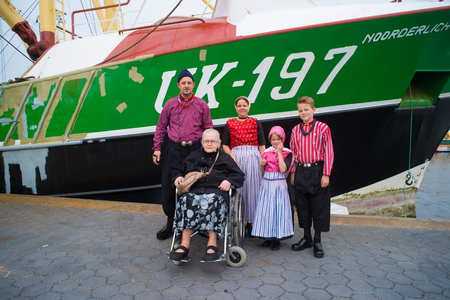 URK, NETHERLANDS - MAY 19, 2018: People in traditional costumes on the Urkerdays. Urk is on of the best-known fishing villages in the country with the largest fishing fleet.のeditorial素材