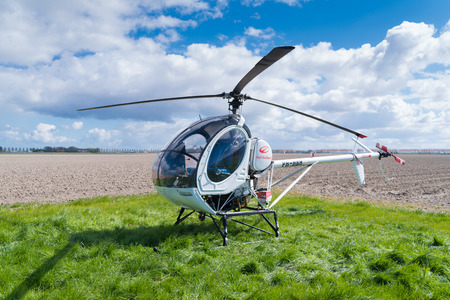 ESPEL, NETHERLANDS - APRIL 17, 2017: Small sightseeing helicopter for a tour over the famous dutch tulip fieldsのeditorial素材