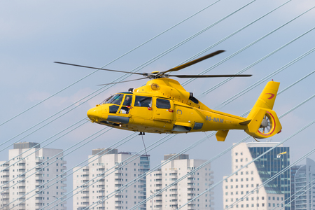 ROTTERDAM, NETHERLANDS - SEPTEMBER 3, 2017: Yellow offshore rescue helicopter doing a demonstration during the Rotterdam world port daysのeditorial素材