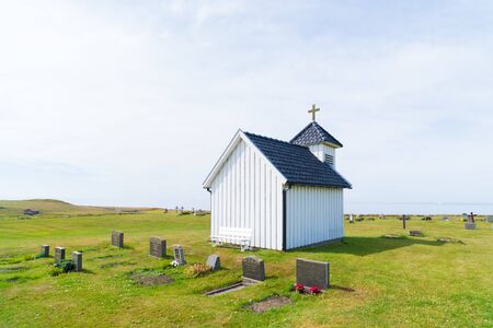 characteristic white chapel belonging to the Varhaug cemetary in Norwayの写真素材