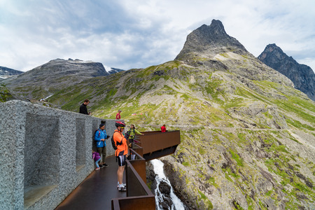 TROLLSTIGEN, NORWAY - JULY 30, 2018: Unique viewpoint platform looking out over the Trollstigen or Trolls Path, a serpentine mountain road in Rauma Municipalityのeditorial素材