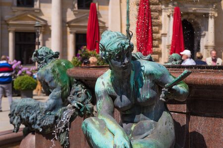 The courtyard of the famous Hamburg city hall is decorated with a Hygieia fountain.の写真素材