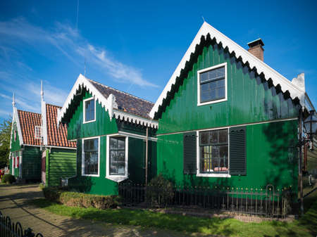 ZAANSE SCHANS, NETHERLANDS - OCTOBER 13, 2018: Typical houses in the Zaanse Schans, a neighborhood with historic wooden buildings in the municipality of Zaanstad.のeditorial素材