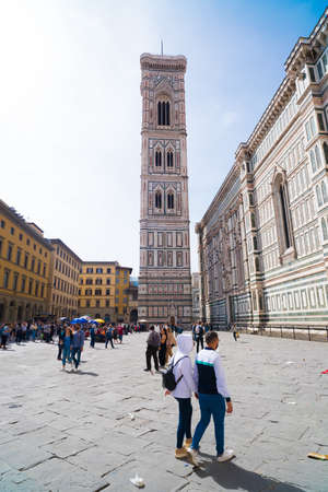 FLORENCE, ITALY - APRIL 21, 2019: Unknown tourists in front of the famous Duomo, also cathedral of Saint Mary of the Flowerのeditorial素材