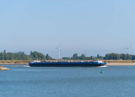 NIJMEGEN, NETHERLANDS - SEPTEMBER 12, 2020: Gas tanker on the Waal river heading for Germanyのeditorial素材