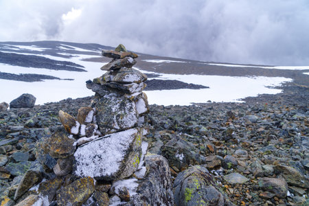 pile of stones made by hikers and climbers along the way to the GaldhÃ¸ppigen top