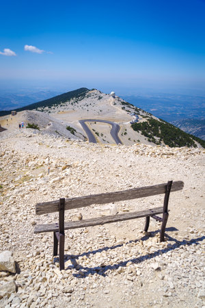 Old weathered bench on top of Mont Ventoux, France. At 1,909 m (6,263 ft), it is the highest mountain in the region and has been nicknamed the "Beast of Provence".の写真素材