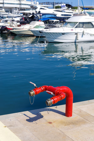 red double fire hydrant in the Cannes old harbourの写真素材