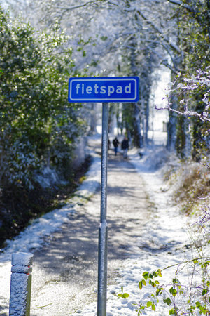 snowy bicycle path (bicycle path in Dutch language)の写真素材