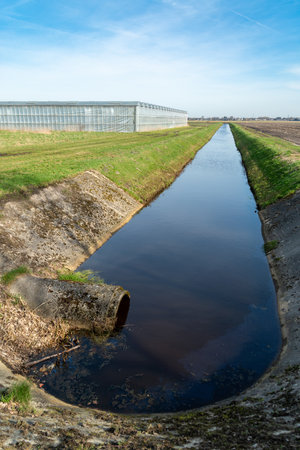 small ditch for water supply around a commercial greenhouseの写真素材