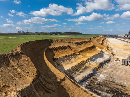 NIEDERZIER, GERMANY - MARCH 29, 2025: Aerial view of the Hambach open-pit coal mine. in Niederzier and Elsdorf, North Rhine-Westphalia. It is used for mining lignite.の写真素材