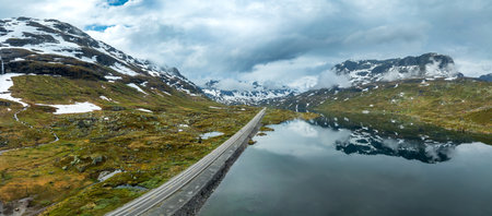 empty road through a wild norwegian landscape