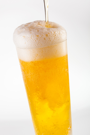 Serving a refreshing ice cold beerの写真素材