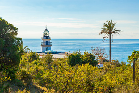 The famous lighthouse near Calella, Costa Brava, Spain, overlooking the blue Mediterranean Sea.の写真素材