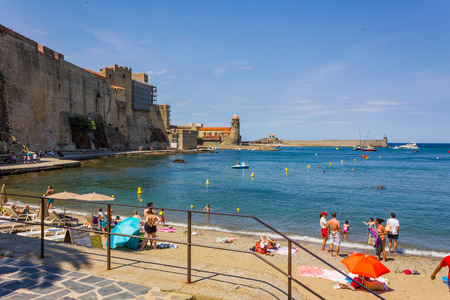 COLLIOURE, FRANCE - JUNE 26: Tourists enjoy the beach of Collioure, coastal village in the south of France, Mediterranean sea, Languedoc Roussillon, Pyrenees Orientalesのeditorial素材