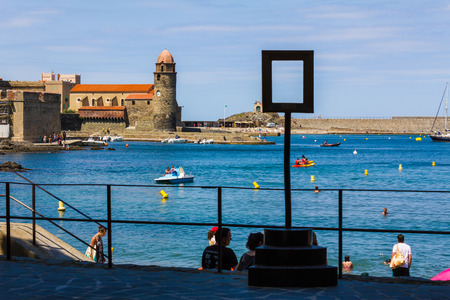 COLLIOURE, FRANCE - JUNE 26: Tourists enjoy the beach of Collioure, coastal village in the south of France, Mediterranean sea, Languedoc Roussillon, Pyrenees Orientalesの写真素材