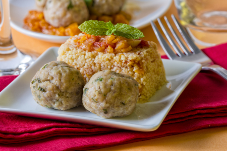 Chicken meatballs served with couscousの写真素材