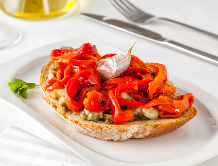 Escalivada on toast. Escalivada is a traditional Catalan dish of grilled eggplant and bell peppers with olive oil.の写真素材