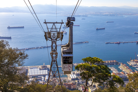 GIBRALTAR, BRITISH OVERSEAS TERRITORY - NOVEMBER 16, 2017: Cable car arriving at the top of the rock of Gibraltar where tourists can enjoy the panoramic view over the bay and the coast of Spain.のeditorial素材