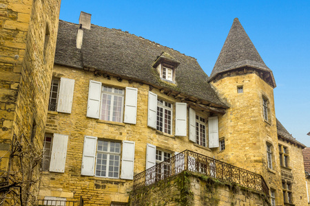 SARLAT-LA-CANEDA, FRANCE - MARCH 2, 2011: Ancient buildings line the narrow streets of the town of Sarlat-la-Caneda, Perigord, France. Goose pate and truffles are the two famous products of the region.のeditorial素材
