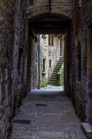 SARLAT-LA-CANEDA, FRANCE - MARCH 2, 2011: View of an arched narrow street at the old town of Sarlat-la-Caneda, Perigord, France.のeditorial素材