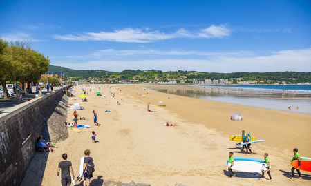 HENDAYE, FRANCE - JUNE 8: Tourists and surfers enjoy the beach of the charming seaside resort of Hendaye on June 8, 2017.のeditorial素材