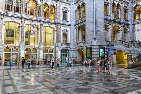 ANTWERP, BELGIUM - AUGUST 4, 2011: Interior of Antwerp main railway station in Antwerp, Belgium. The station was built between 1895 and 1905.のeditorial素材