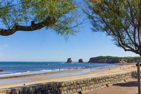 HENDAYE, FRANCE - JUNE 8: Tourists and surfers enjoy the beach of the charming seaside resort of Hendaye on June 8, 2017.のeditorial素材