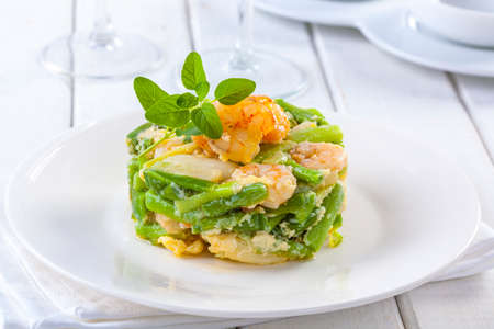Delicious dish of green asparagus with shrimps.の写真素材